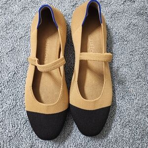 Rothy's Tan and Black Flats with Blue Trim